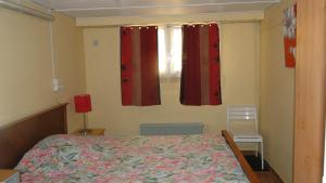 En eller flere senge i et værelse på Gîte Debussy