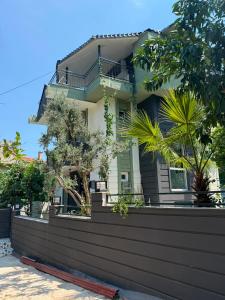 a house with a fence in front of it at Luxury villa in mountain in Geyikbayırı