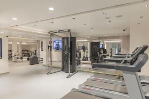 a gym with tread machines and a mirror at The Crown, Bhubaneswar - IHCL SeleQtions in Bhubaneshwar