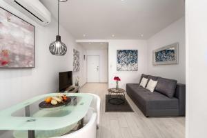 a living room with a couch and a table at SILVER luxury in Pula
