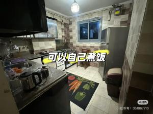 a kitchen with a counter and a stove top oven at شقق وهوستل قصر الشباب للمصريين و المقيمين فقط Youth Palace Hostel & Apartments for Egyptians & Residents Only in Alexandria