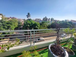a balcony with a view of a city at Cozy 2-Bed Portion at Gulshan Iqbal blk 7 in Karachi