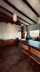 a large room with two beds and a table at Puro Campo in Tafí del Valle