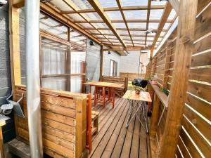 a room with a wooden deck with a table at NOA - Vacation STAY 80085v in Shikyū +13 photos