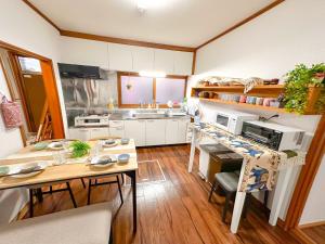 a small kitchen with a table and a counter top at NOA - Vacation STAY 80085v in Shikyū