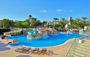 a swimming pool with a water slide in a resort at SOL by Meliá Barbados in Magaluf