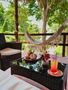 a table with food and drinks on a patio at Ocean Vibes Resort in Thong Sala +76 photos