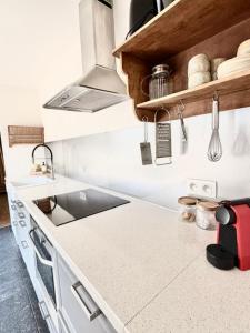 a kitchen with a sink and a counter top at De Blinker in Damme +31 photos