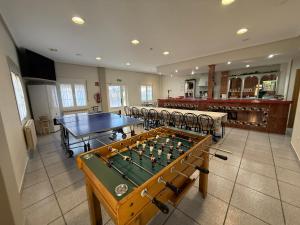 a room with a ping pong table and a pool table at El abrazo de La Yecla in Espinosa de Cervera