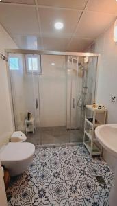 a bathroom with a shower and a toilet and a sink at Adrasan village house in Kumluca