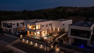 an aerial view of a house at night at Villa Perla Vir in Vir