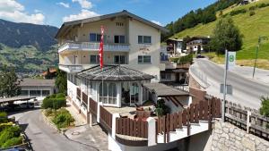 a building with a red stripe on the side of it at Pitztal Living Apartments in Jerzens