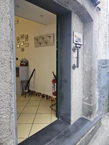 an open door into a room with a tile floor at CasaFiore Guest House in Vietri sul Mare