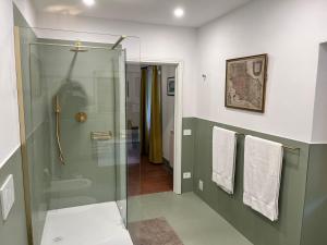 a bathroom with a shower and a glass shower stall at Vista Romena in Pratovecchio +22 photos