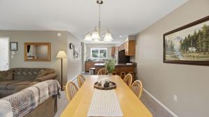 a living room with a table and a couch at Fox Lair by AvantStay in North Creek