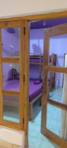 two bunk beds in a room with a window at East Breeze in Arugam Bay