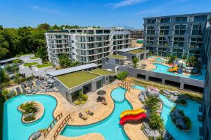 an aerial view of a water park at a resort at Relax, Swim & Stay Active in this Duplex - UTL B131 in Rawai Beach