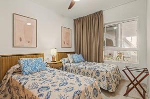 a hotel room with two beds and a window at Callao Beach 2 in Arrieta