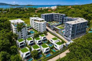 an aerial view of a building with green roofs at Relax, Swim & Stay Active in this Duplex - UTL B131 in Rawai Beach