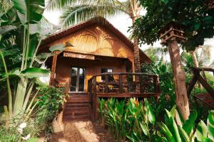 a small building in the middle of a forest at Bamboo Eco Village in Can Tho