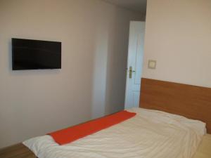 Łóżko lub łóżka w pokoju w obiekcie Hotel Pod Platanami