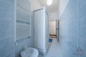 a bathroom with a white toilet and a mirror at Gramsci House - Sea 3 min - Central - Family in Vado Ligure +18 photos