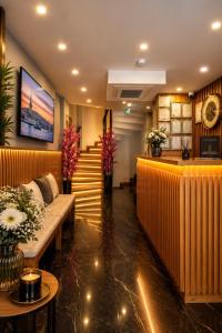 a lobby of a hotel with benches and a counter at Art Karakoy Hotel in Istanbul