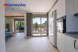 an open living room with a view of a patio at Villa Elyse & Paradise in Orta