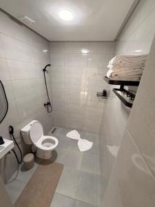 a small bathroom with a toilet and a sink at Riad Villa Elizabeth in Nouaseur