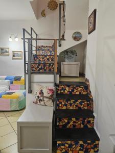 a room with stairs with wine bottles at CasaFiore Guest House in Vietri sul Mare