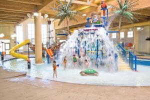 a group of children playing in a water park at Bridges Bay Resort in Arnolds Park