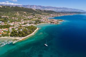 an aerial view of a small island in the ocean at Apartments Biserka G in Palit