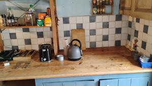 a kitchen counter with a tea kettle on it at Number 33 Village house in Rancon sleeps 4 in Rancon