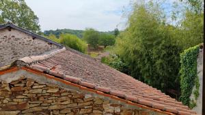 a roof of a stone building with trees in the background at Number 33 Village house in Rancon sleeps 4 in Rancon
