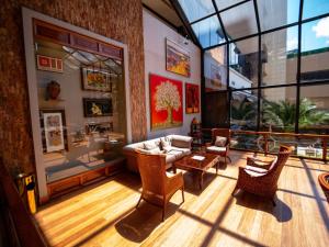 a living room with a couch and chairs at Swissotel Quito in Quito