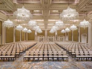 a large room filled with chairs and chandeliers at Raffles Singapore in Singapore +201 photos