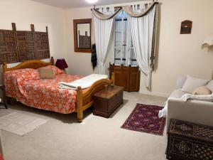 a bedroom with a bed and a window at Chez Paulet A welcome break for peace and tranquility - route C27 in Lobard +14 photos