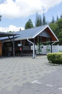 a pavilion with tables and chairs in a patio at The Hank Bethlehem Pty Ltd in Bethlehem
