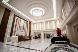 a lobby of a hotel with a chandelier at Meridian Plaza by Reikartz in Samarkand +62 photos