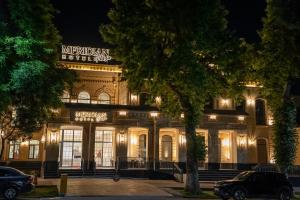 a building with a sign on the front of it at Meridian Plaza by Reikartz in Samarkand