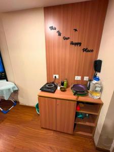 a desk in a room with writing on the wall at The Skyline Studio in Greater Noida