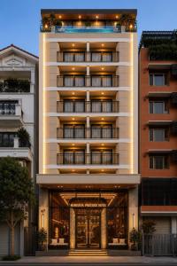 a hotel building with an entrance to the front at Minerva Prestige Hotel in Hanoi