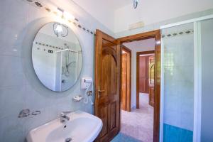 a bathroom with a sink and a mirror and a shower at Il Vigneto in Tramonti +36 photos