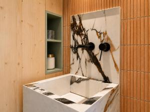 a bathroom with a sink and a mirror at Viviendas El Tiburón in Almerimar +41 photos
