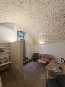a living room with a couch and a table at Casa Maresca in Ostuni