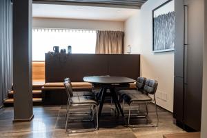 a dining room with a table and chairs at Lumia Hotel in Termoli