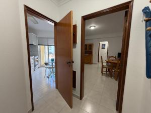 a open door to a kitchen and a dining room at Casa Nau C in Armação de Pêra +7 photos