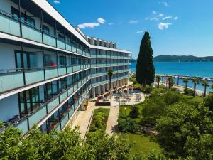an office building with a view of the water at Ilirija Resort Hotel Ilirija in Biograd na Moru