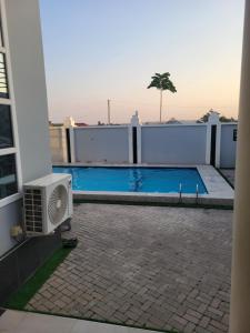 a swimming pool on the roof of a building at City Link Complex Ressort in Mwanza
