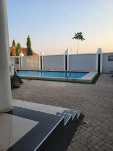 a swimming pool on top of a building at City Link Complex Ressort in Mwanza